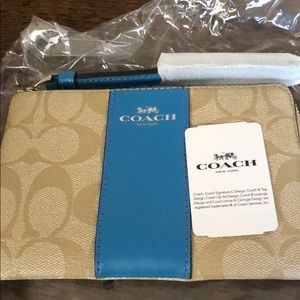 Wristlet coach wallet.